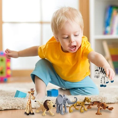 A young child playing with a group of toy animals